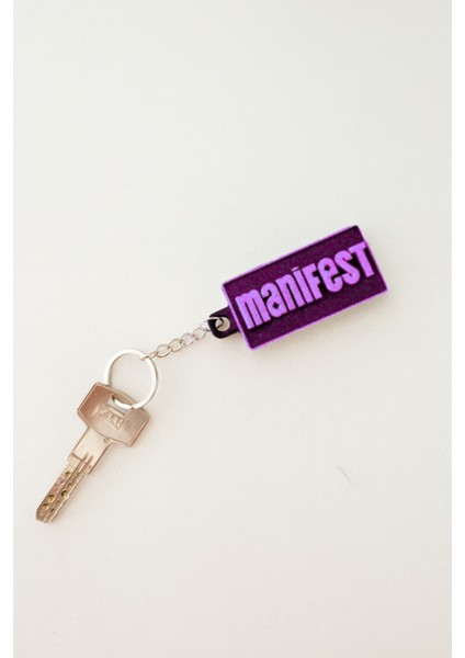 Mor Manifest Yazılı Dikdörtgen Anahtarlık – Özel Tasarım Kalın – Manifest Grubuna Özel modelleri