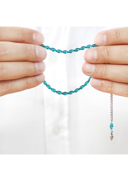 Ateş Kehribar Tesbih - Kararmaz Metal Püsküllü - Mini Boy - Şeffaf Turkuaz - Arpa Kesim fırsatları