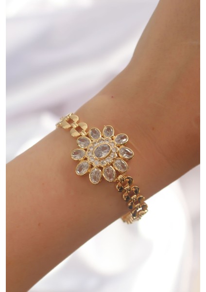 Pirinç Gold Renk Iri Zirkon Taşlı Çiçek Figürlü Bileklik - Lisinya