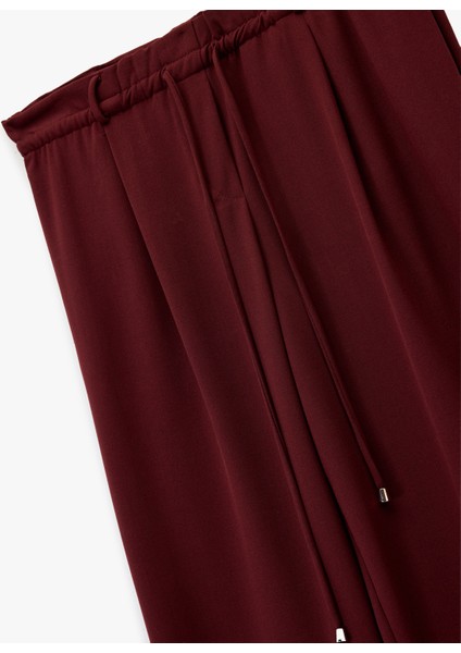 Beli Bağcıklı Bağlamalı Cepli Düz Geniş Paça Kumaş Pantolon modelleri