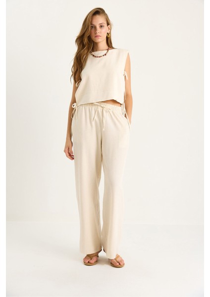 Kadın Luccı Yuvarlak Yaka Kravat Kapatmalı Iki Parçalı Geniş Paça Pantolon Takımı Bej Doğal fiyatları
