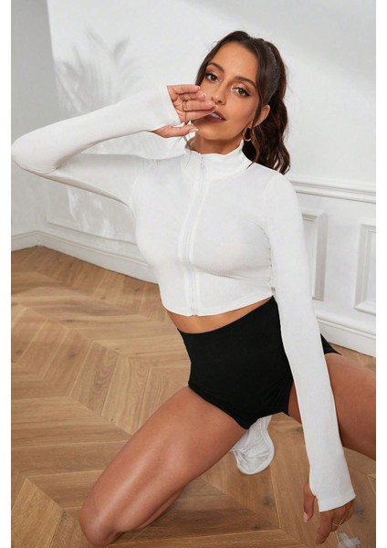 Kadın Beyaz Uzun Kol Fermuarlı Parmak Geçme Detaylı Dik Yaka Crop Top Bluz indirimleri