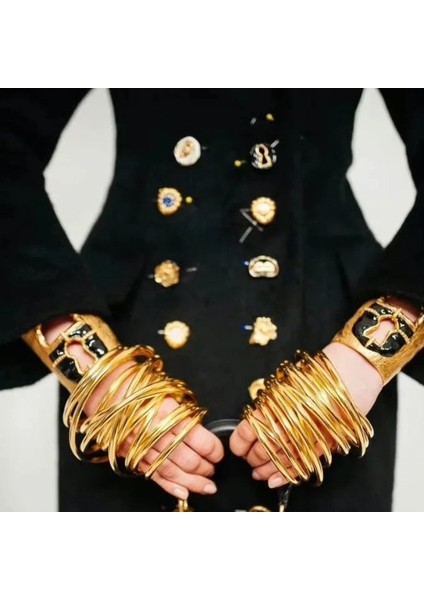 Metal Dokulu Siyah Altın Damla Yağlı Kilitli Geniş Bileklik (Yurt Dışından) fiyatları