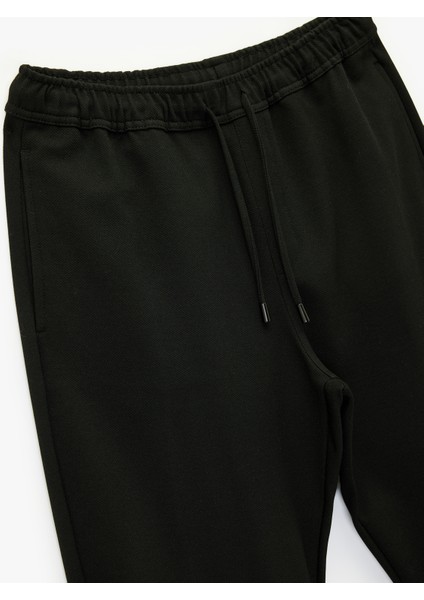 Viskon Karışımlı Duble Paça Cepli Beli Bağcıklı Pantolon modelleri