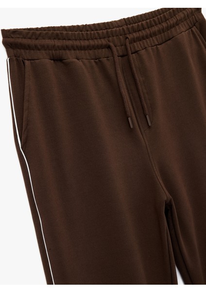 Pamuklu Biyeli Cep Detaylı Beli Bağcıklı Eşofman Altı modelleri