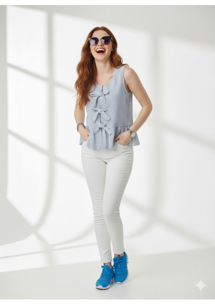 Çizgili Gofre Kolsuz Fiyonk Detaylı Bluz fırsatları