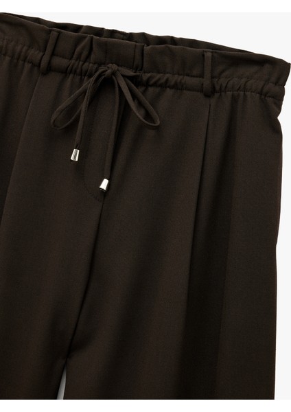 Beli Bağcıklı Bağlamalı Cepli Düz Geniş Paça Kumaş Pantolon modelleri