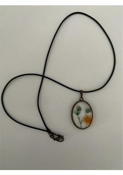 Kurutulmuş Sarı Yeşil Çiçek Figürlü Kolye Siyah Deri Ipli fiyatları