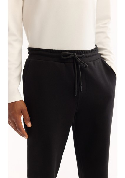 Erkek Siyah Beli Lastikli Bağcıklı Pamuklu Bi-Stretch Regular Fit Eşofman Altı A52Y3403 fırsatları