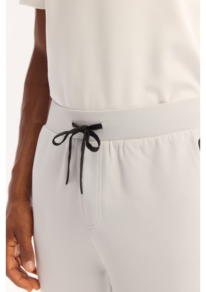 Erkek Açık Gri Beli Lastikli Bağcıklı Bi-Stretch Regular Fit Eşofman Altı A52Y3416 modelleri