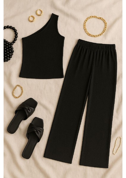 Kadın Siyah Tek Omuzlu Şık Bluz & Geniş Paça Pantolon Ikili Takım – Modern, Konforlu ve Günlük Kombinlere Uygun