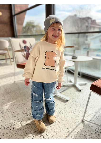 Kız Çocuk Pamuklu Krem Baskılı Sweatshirt ve Yırtık Detaylı Denim Pantolon Takım fiyatları