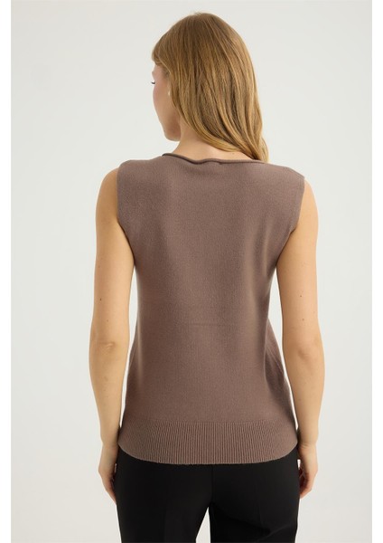 Kolsuz Kıvrık Yaka Triko indirimleri