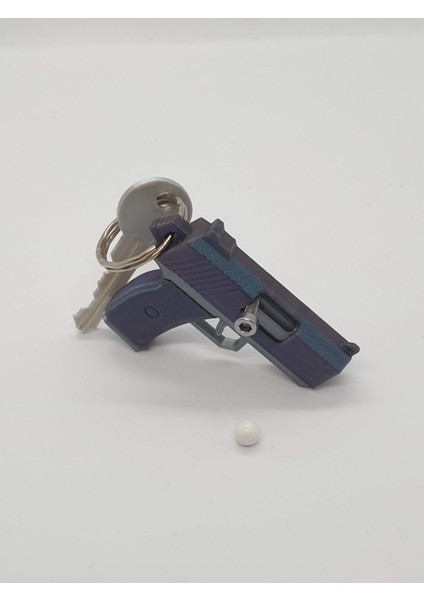 Tabanca Anahtarlık — Fonksiyonel Püskürtücü ve Kıpırdayan Oyuncak modelleri