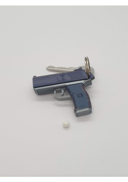 Tabanca Anahtarlık — Fonksiyonel Püskürtücü ve Kıpırdayan Oyuncak indirimleri