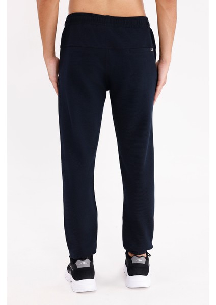 Pıtırcık Yüzeyli Elastik Belli Rahat Kesim Yan Cepli Düz Paça Spor Eşofman Altı modelleri