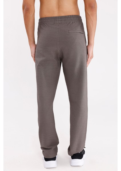 Petek Dokulu Yüzeyli Rahat Kalıp Ayarlanabilir Kordonlu Yan Cepli Lastik Paça Spor Eşofman Altı modelleri