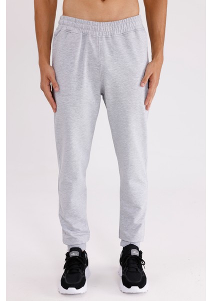 Esnek Bel Lastikli Yan Cepli Arka Cepli Daralan Paça Minimal Logo Detaylı Konforlu Spor Eşofman Altı