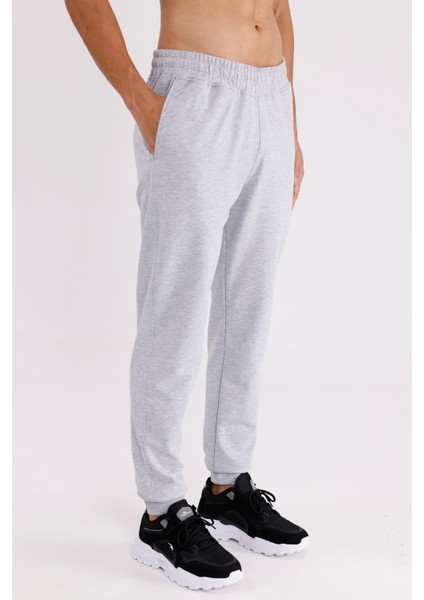 Esnek Bel Lastikli Yan Cepli Arka Cepli Daralan Paça Minimal Logo Detaylı Konforlu Spor Eşofman Altı fırsatları