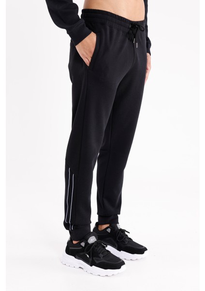 Modal Karışımlı Rahat Kalıp Kordonlu Elastik Bel Yan Cepli Reflektif Şerit Detaylı Ribana Paça Eşofman Altı fırsatları