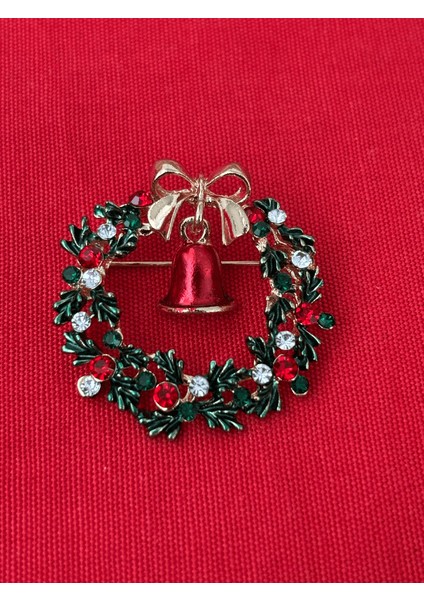 Kırmızı Zil Detaylı Parlak Taşlı Yıbaşı Çelenk Figürlü Gold Broş fiyatları