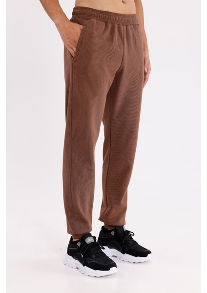 Pıtırcık Yüzeyli Elastik Belli Rahat Kesim Yan Cepli Düz Paça Spor Eşofman Altı fırsatları