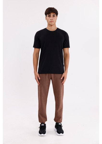 Pıtırcık Yüzeyli Elastik Belli Rahat Kesim Yan Cepli Düz Paça Spor Eşofman Altı indirimleri