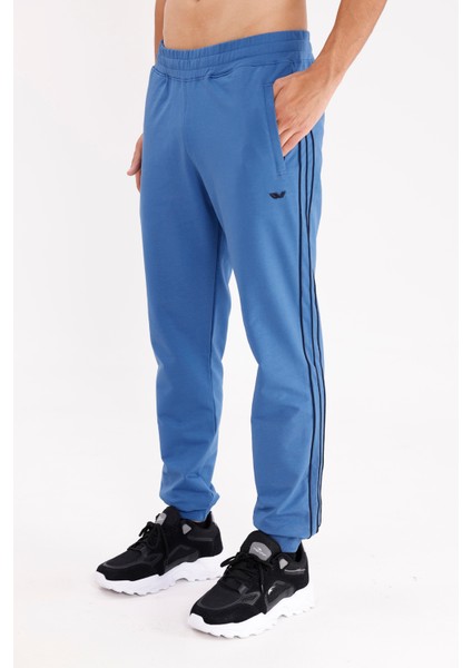 Yan Şerit Detaylı Esnek Bel Cepli Standart Kalıp Mevsimlik Örme Kumaş Eşofman Altı fiyatları