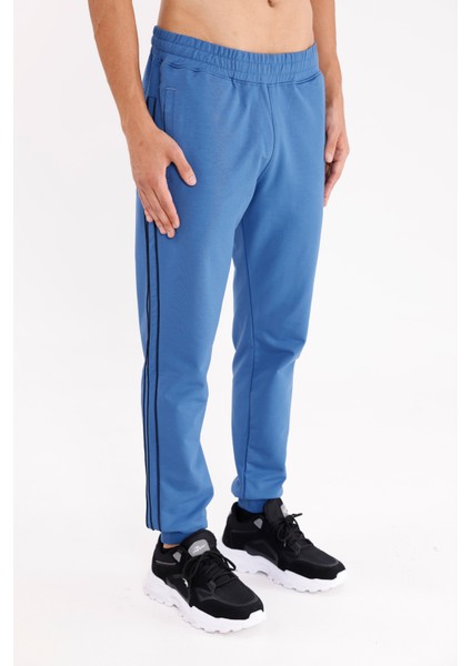 Yan Şerit Detaylı Esnek Bel Cepli Standart Kalıp Mevsimlik Örme Kumaş Eşofman Altı fırsatları