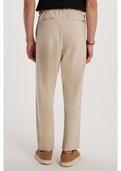 Erkek Regular Fit Çift Pileli Beli Lastikli Rahat Kesim Bol Paça Baggy Bej Pantolon fiyatları