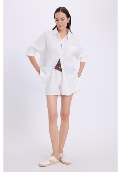 Kadın Oversize Geniş Kesim %100 Pamuk Müslin Kumaş Uzun Kollu Cepli Dokulu Beyaz Gömlek fırsatları