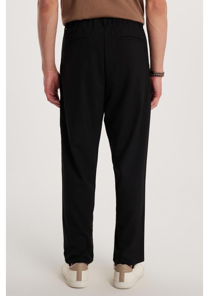 Erkek Regular Fit Çift Pileli Beli Lastikli Rahat Kesim Bol Paça Baggy Siyah Pantolon modelleri