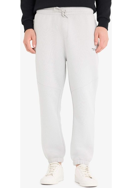 Regular Fit Beli Bağcıklı İçi Yumuşak Tüylü Paçası Lastikli Baskılı Fermuar Cepli Eşofman Altı