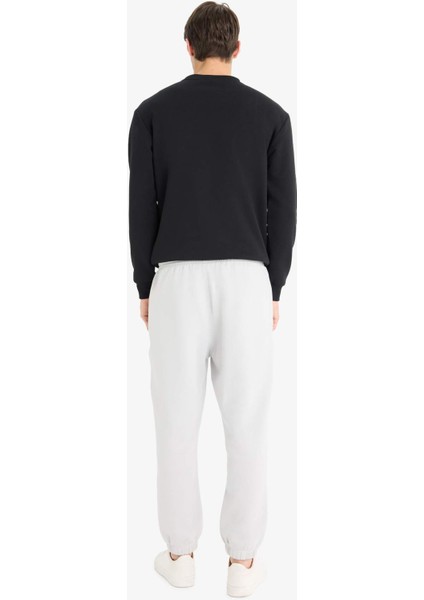 Regular Fit Beli Bağcıklı İçi Yumuşak Tüylü Paçası Lastikli Baskılı Fermuar Cepli Eşofman Altı