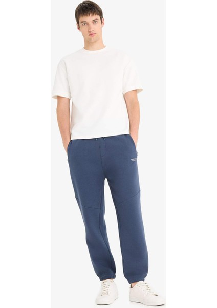 Regular Fit Beli Bağcıklı İçi Yumuşak Tüylü Paçası Lastikli Baskılı Fermuar Cepli Eşofman Altı