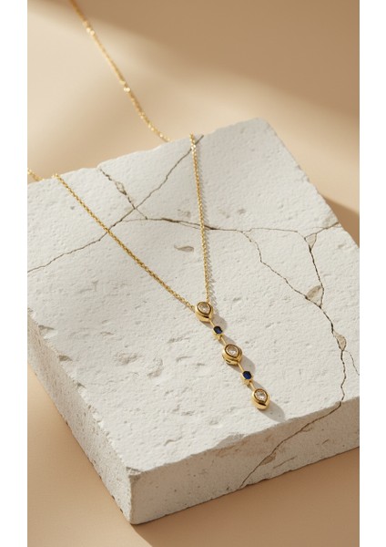 Altın Rengi Zirkon ve Lacivert Taş Detaylı Uzun Sallantılı Kolye modelleri