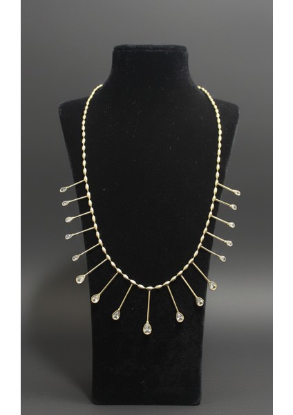 Altın Rengi Damla Zirkon Taşlı Kirpik Detaylı Kolye fiyatları