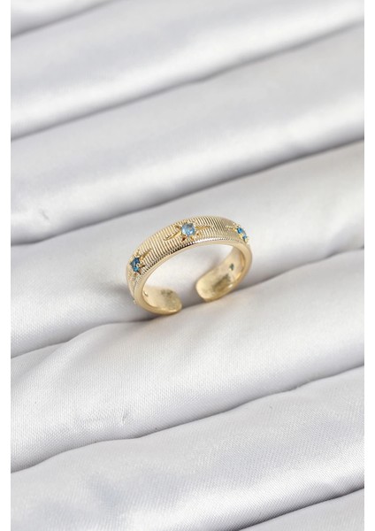 Pirinç Gold Renk Mavi Zirkon Taşlı Kutup Yıldızı Model Kadın Yüzük