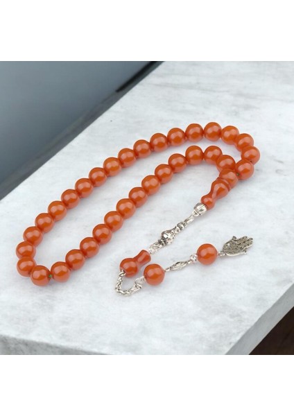 Burhan sağlam Küre Kesim 11x10 mm Sıkma Kehribar Alpaka Püsküllü Tesbih indirimleri