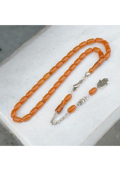 Burhan sağlam Kapsül Kesim 11x7 mm Sıkma Kehribar Alpaka Püsküllü Tesbih indirimleri