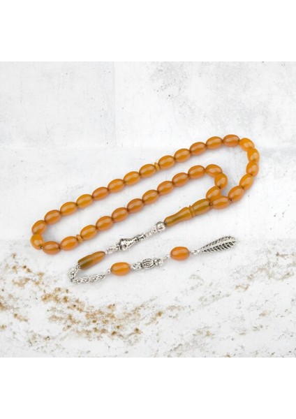 Burhan sağlam Kapsül Kesim 11x9 mm Sıkma Kehribar Alpaka Püsküllü Tesbih indirimleri