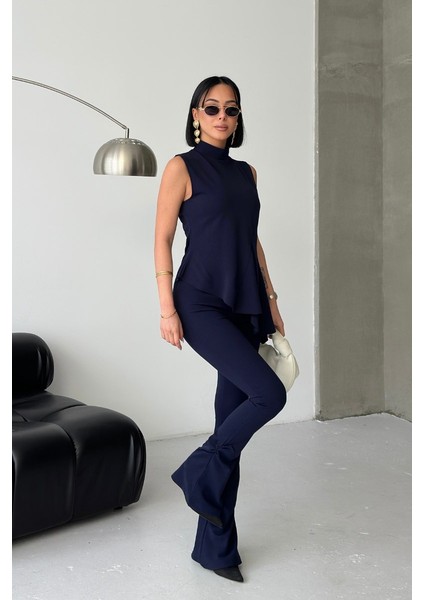 Kadın Alt Üst Takım Sıfır Kollu Balıkçı Yaka Fırfırlı Asimetrik Bluz Ispanyol Paça Büzgülü Pantolon Ikili Takım fırsatları
