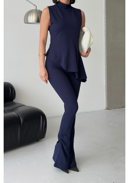 Kadın Alt Üst Takım Sıfır Kollu Balıkçı Yaka Fırfırlı Asimetrik Bluz Ispanyol Paça Büzgülü Pantolon Ikili Takım