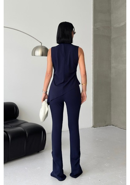 Kadın Alt Üst Takım Sıfır Kollu Balıkçı Yaka Fırfırlı Asimetrik Bluz Ispanyol Paça Büzgülü Pantolon Ikili Takım