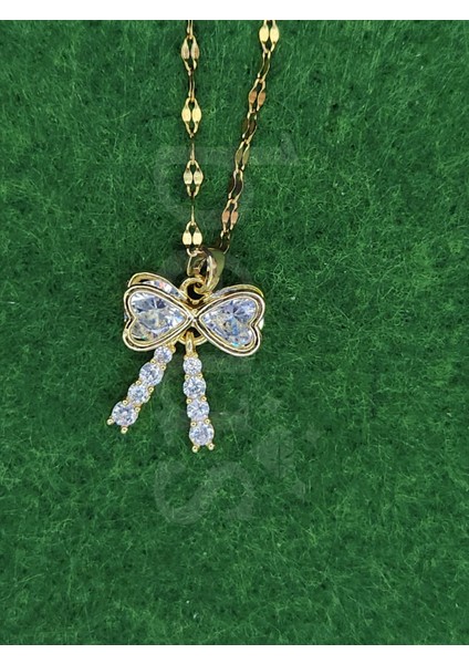 - Zirkon Taşlı Damla Detaylı Gold Kaplama Çelik Fiyonk Kolye modelleri