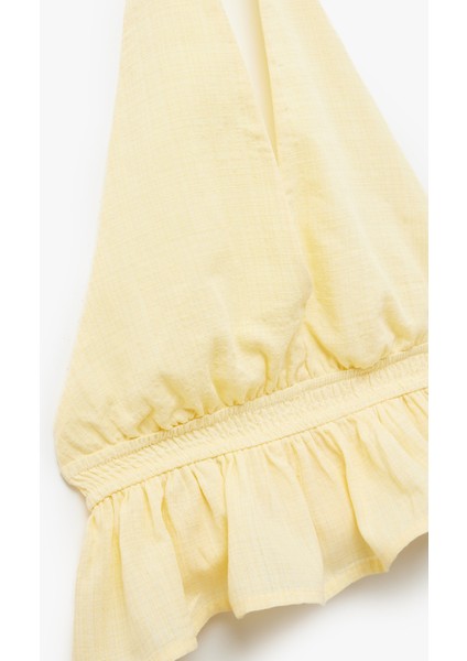 Sırt Detaylı Slim Fit Fırfırlı Kolsuz Viskon Karışımlı Halter Yaka Crop Bluz indirimleri