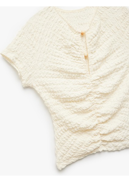 Slim Fit Kısa Kollu Boncuk Detaylı Bürümcük Kumaş Dokulu Tişört indirimleri