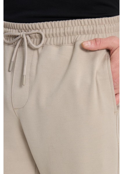 Erkek Regular Fit Klasik Kesim Beli Lastikli Bağcıklı Bej Jogger Pantolon