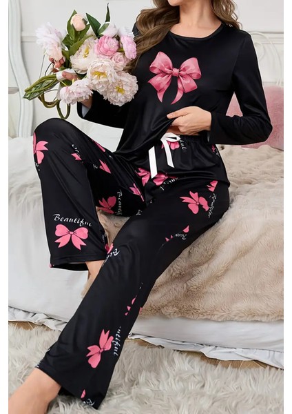 Şık ve Rahat Siyah Kadın Pijama Takımı - Kelebek Desenli ve Yay Detaylı Tasarım indirimleri