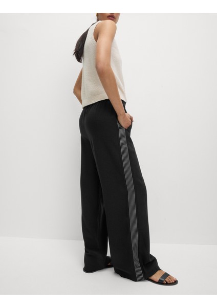 Dokuma Yan Şeritli Bol Paça Pantolon fiyatları